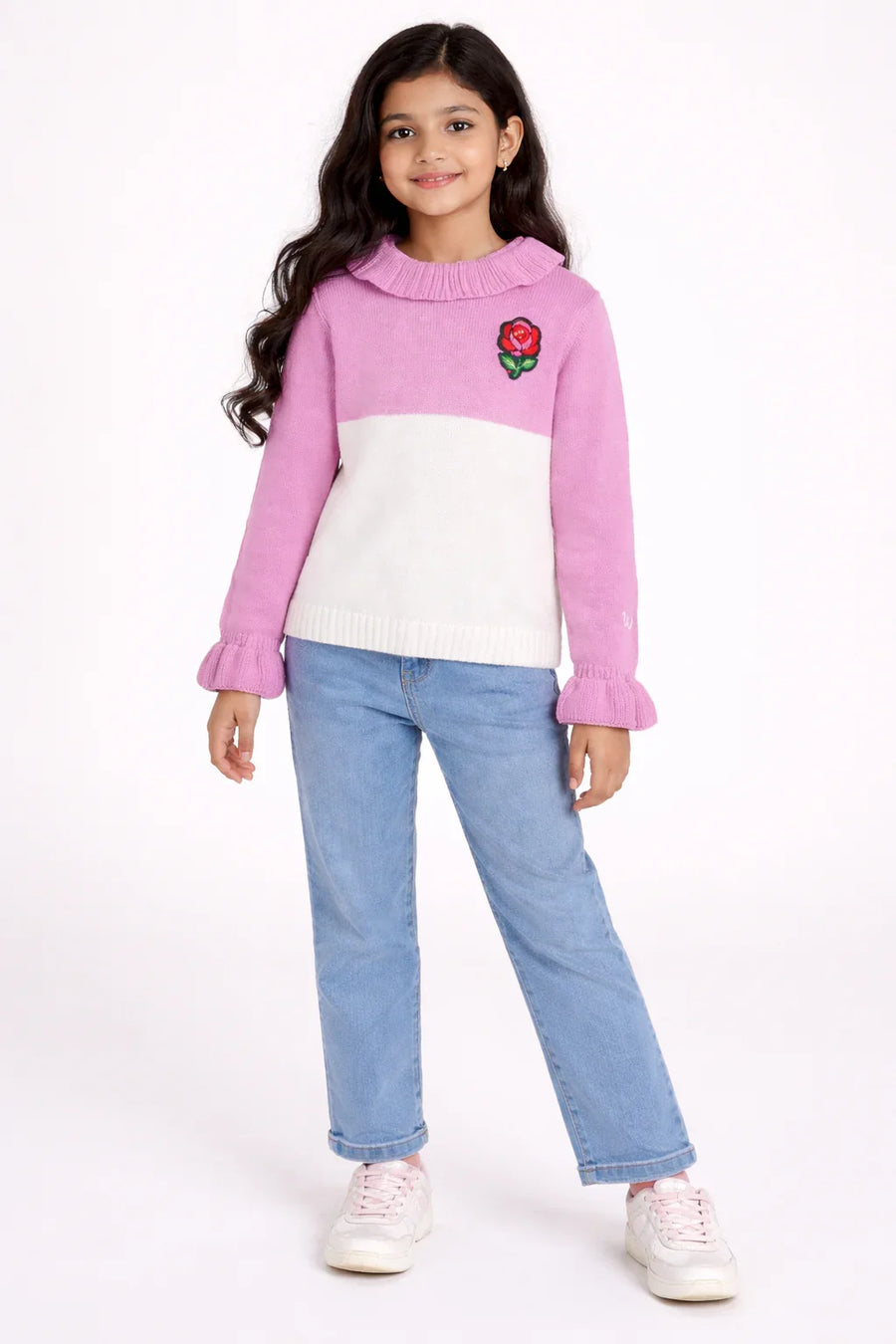 Knitted dual color sweater with ruffle detailing